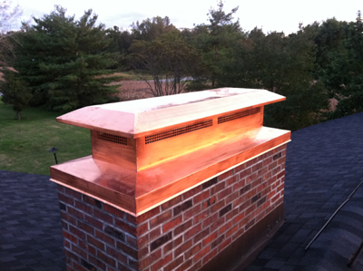 Before and after chimney cap replacement in New Hyde Park, NY