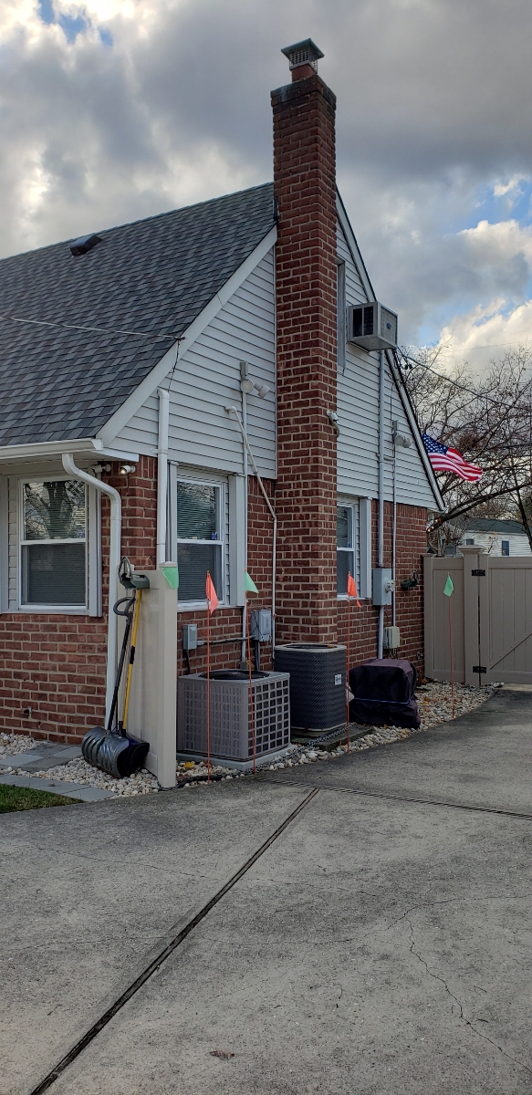 Professional chimney repointing restoring brick joints in New Hyde Park, NY