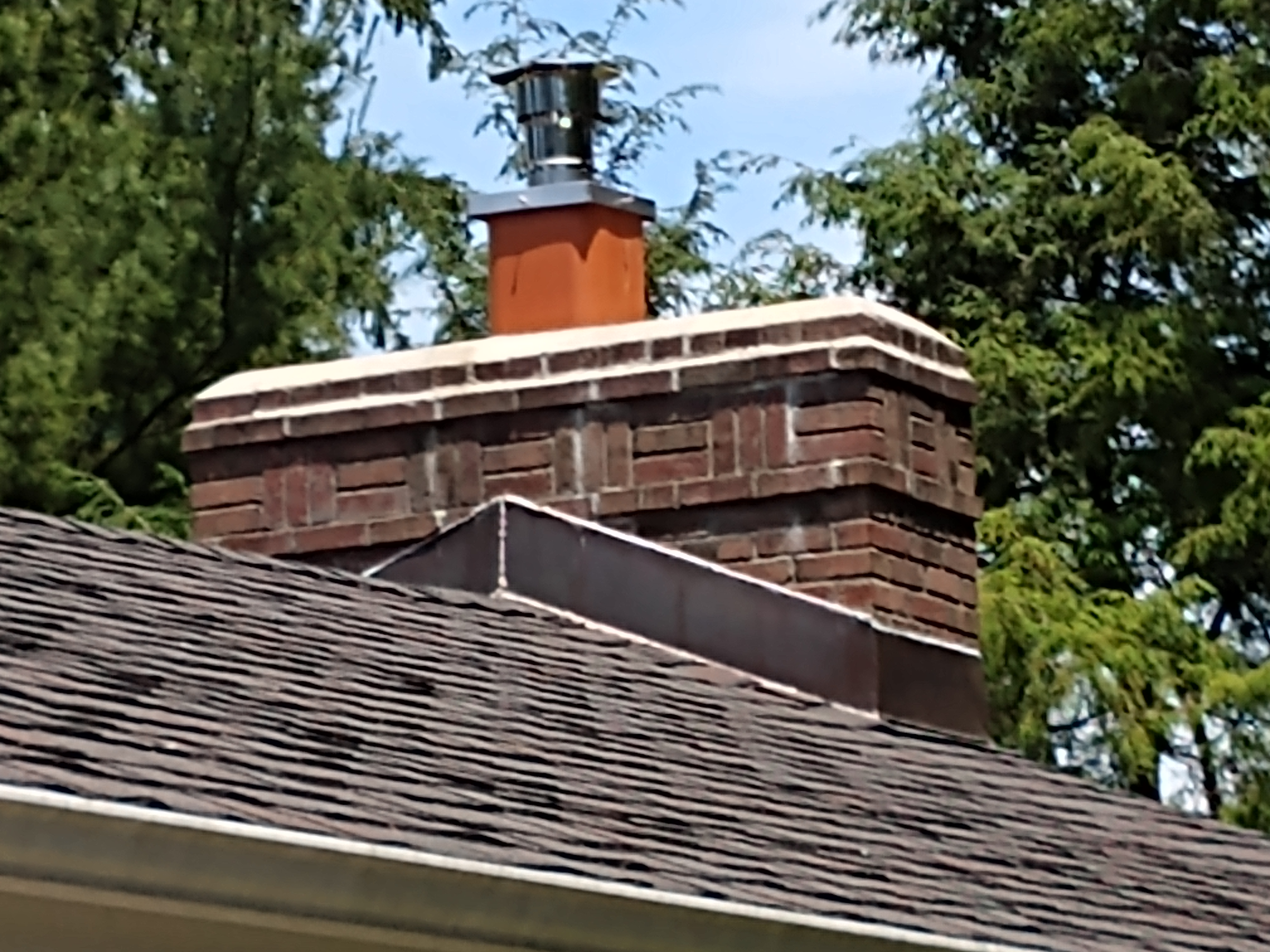 Stainless steel chimney cap with animal guard in New Hyde Park, New York